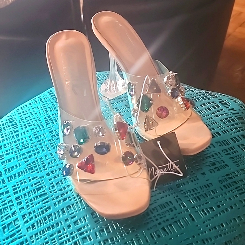 Clear high-heeled shoes with gem stones